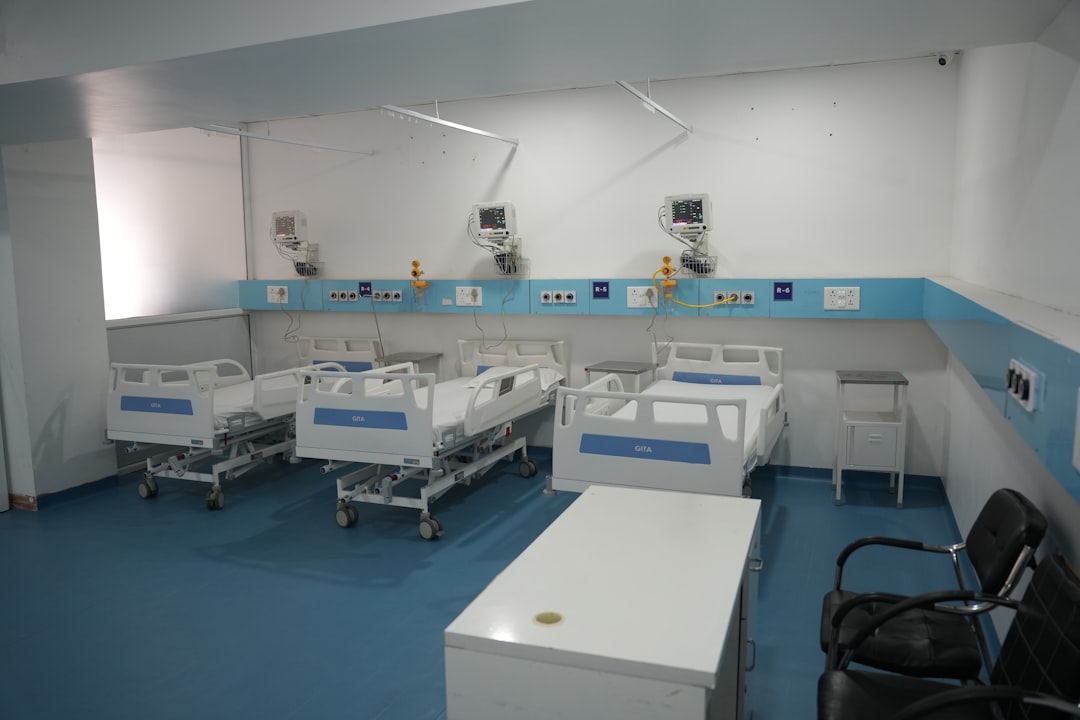 Hospital ward with beds and medical equipment