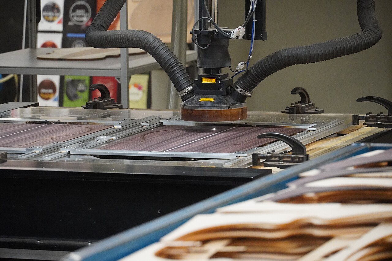CNC laser-cutting machine cutting a sheet in a manufacturing unit